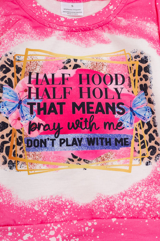 Half hood half holy That means Pray with me Don't Play me.