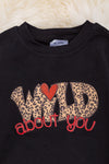 Wild about you" Black cotton made baby onesie w/ leopard sleeves. RPG05154012 NAYDINE