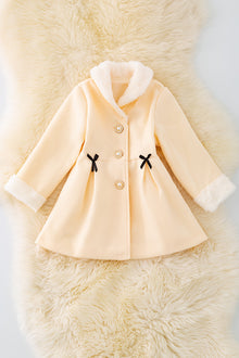  TPG40409 Sol: Ivory lined jacket with cozy fur trim.