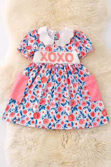  XO XO XO Floral smocked dress with side pockets. DRG50077AMY