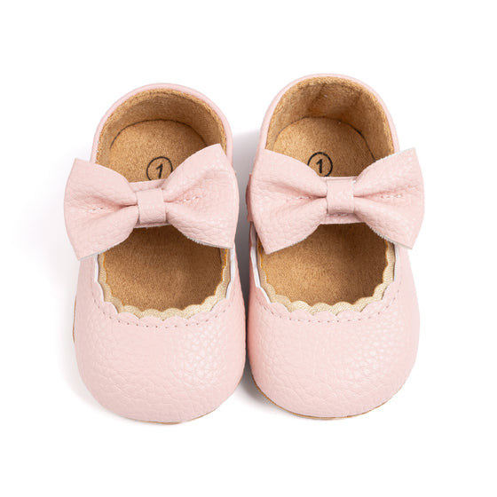 White pleather baby shoes. HM1628